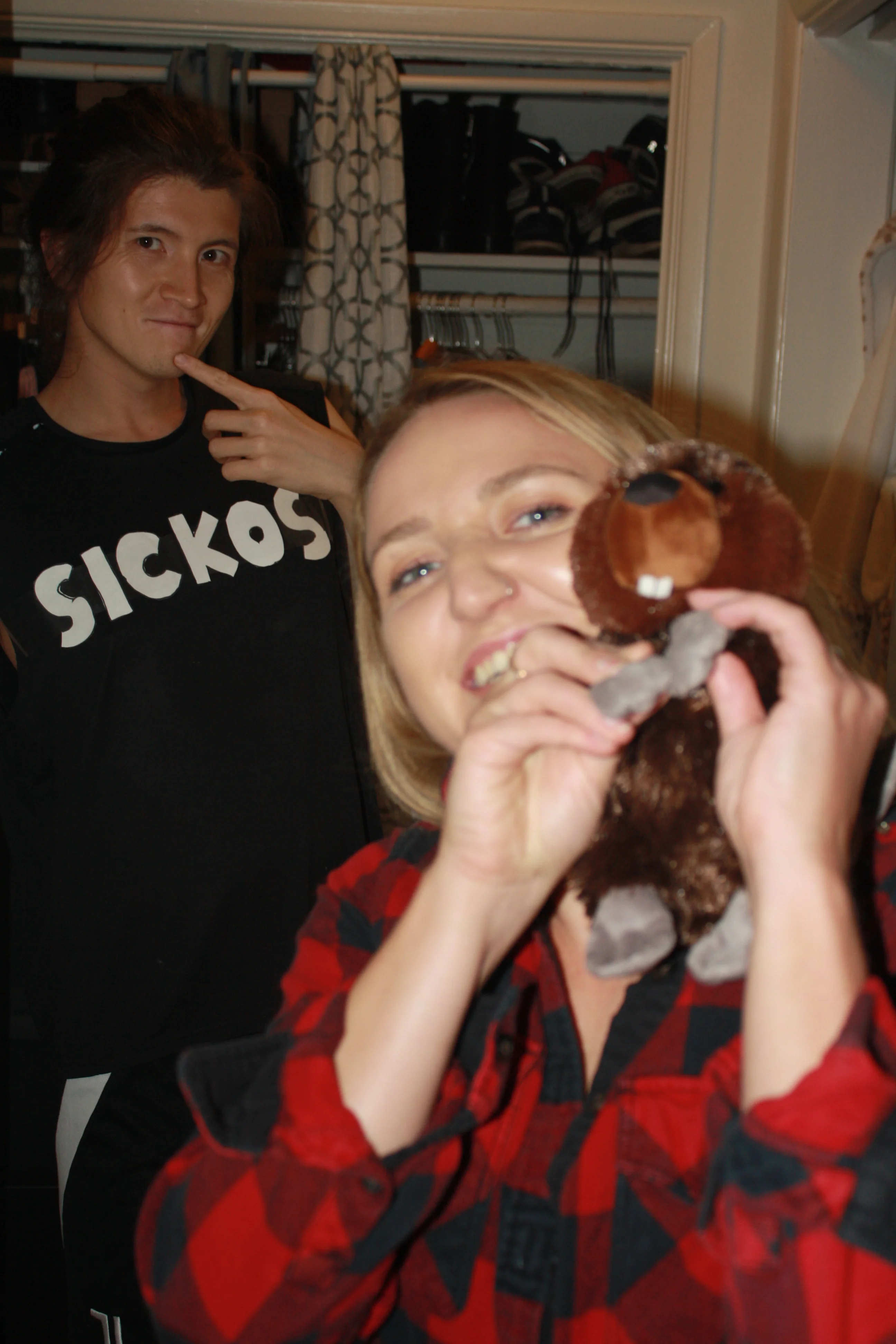 Friends dressed as a beaver and a Creeper